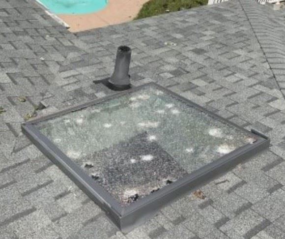 A skylight damaged by hail